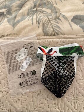 Men's fishnet g-string with palm pattern waistband